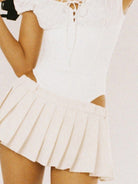 SweetChilling Sporty Paneled Cutout Pleated Mini Dress in White - On Female Model
