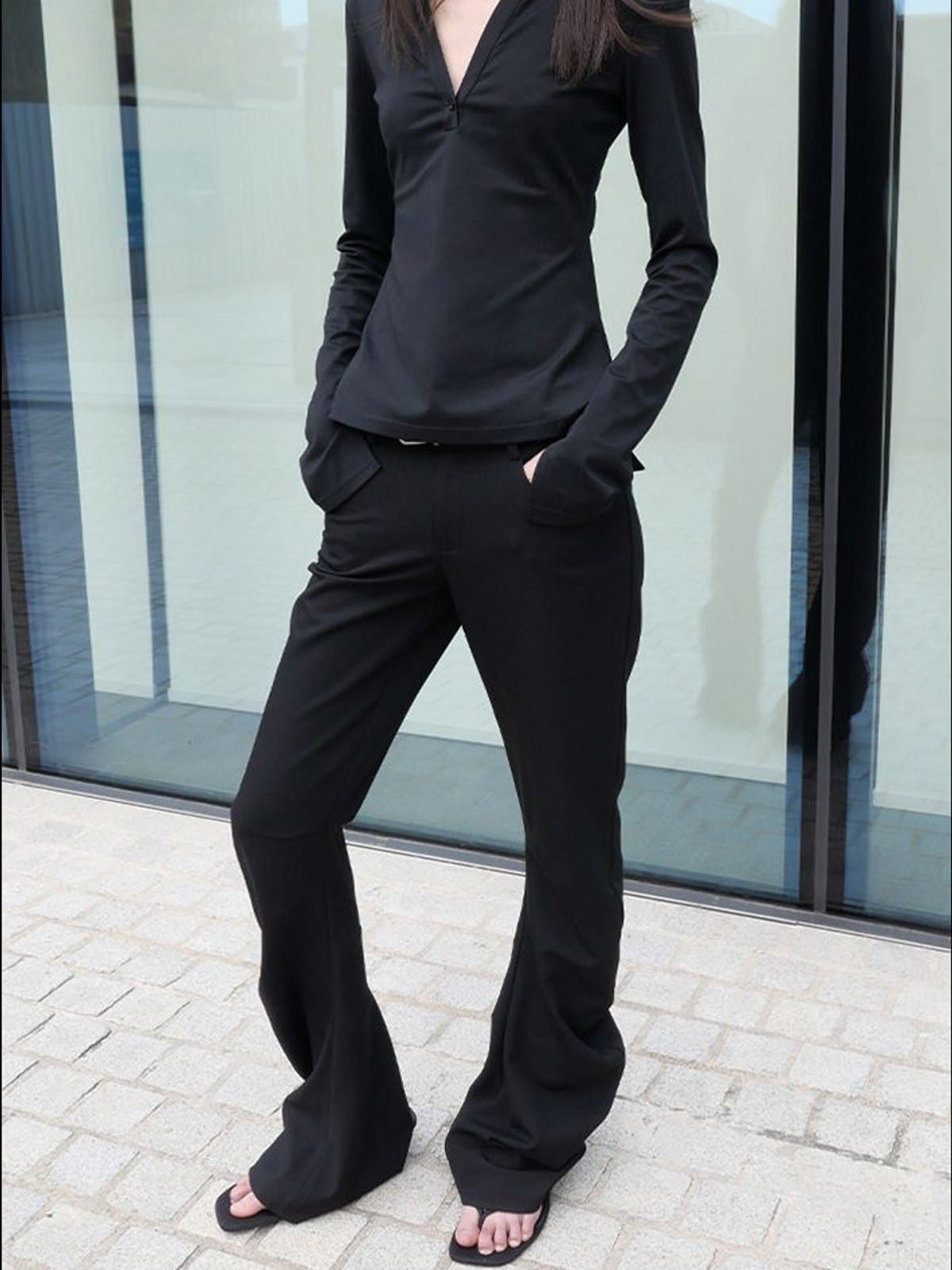 RARELY ALIKE Curved Leg Flared Dress Pants in Black - On Female Model