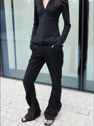 RARELY ALIKE Curved Leg Flared Dress Pants in Black - On Female Model