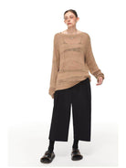 SIMPLE PROJECT Pleated Cropped Wide Leg Trousers in Black - On Female Model