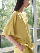 MSBEAST Oversized Acetate Satin T Shirt in Yellow - On Female Model
